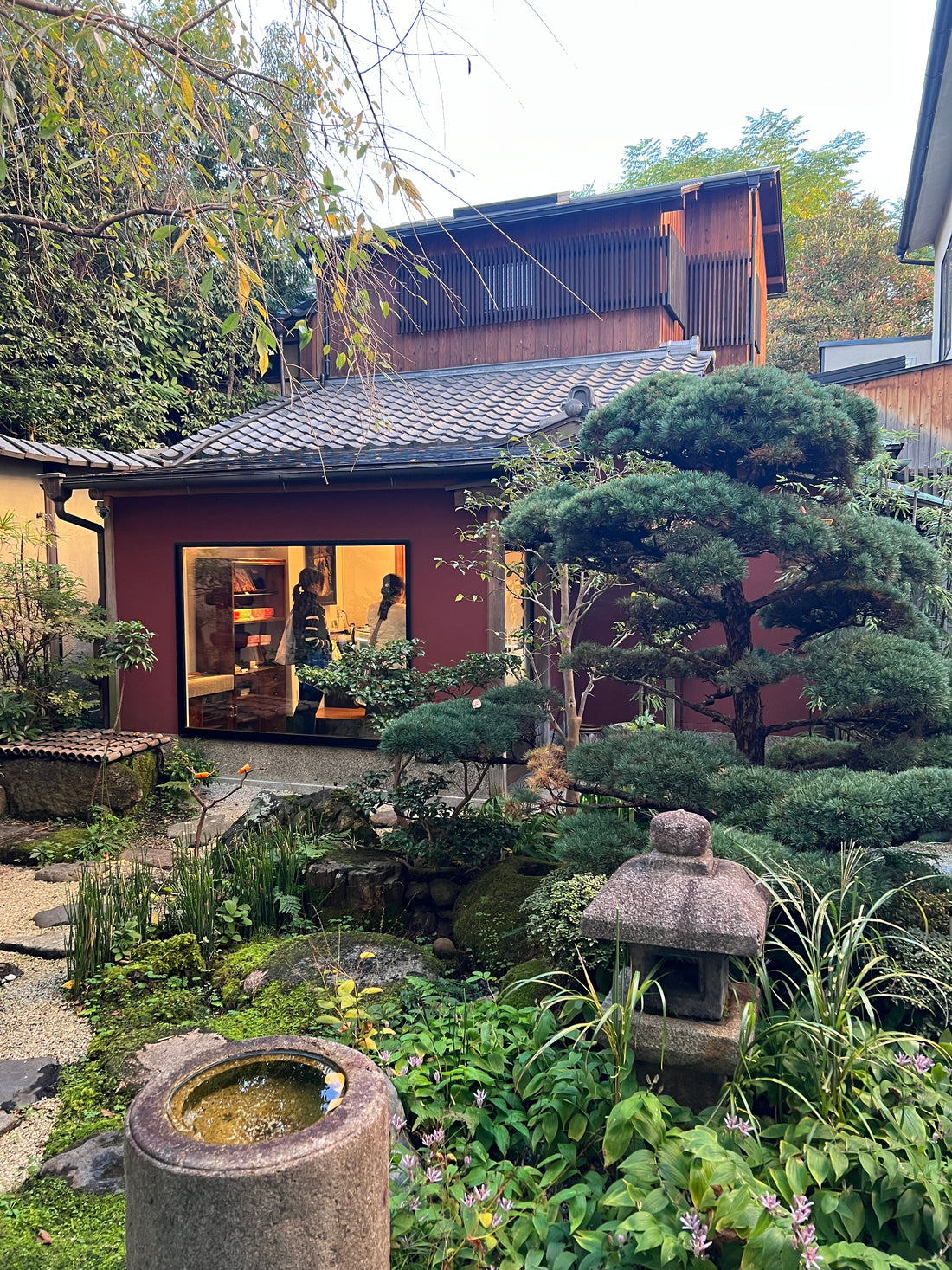 The exterior of a needle shop located within a Japanese garden