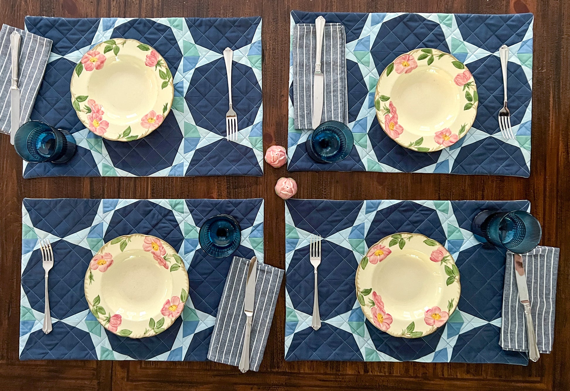 Night Bloom Quilt Pattern - Julia Wachs Designs - Dark blue Night Bloom placemats set with Desert Rose plates.