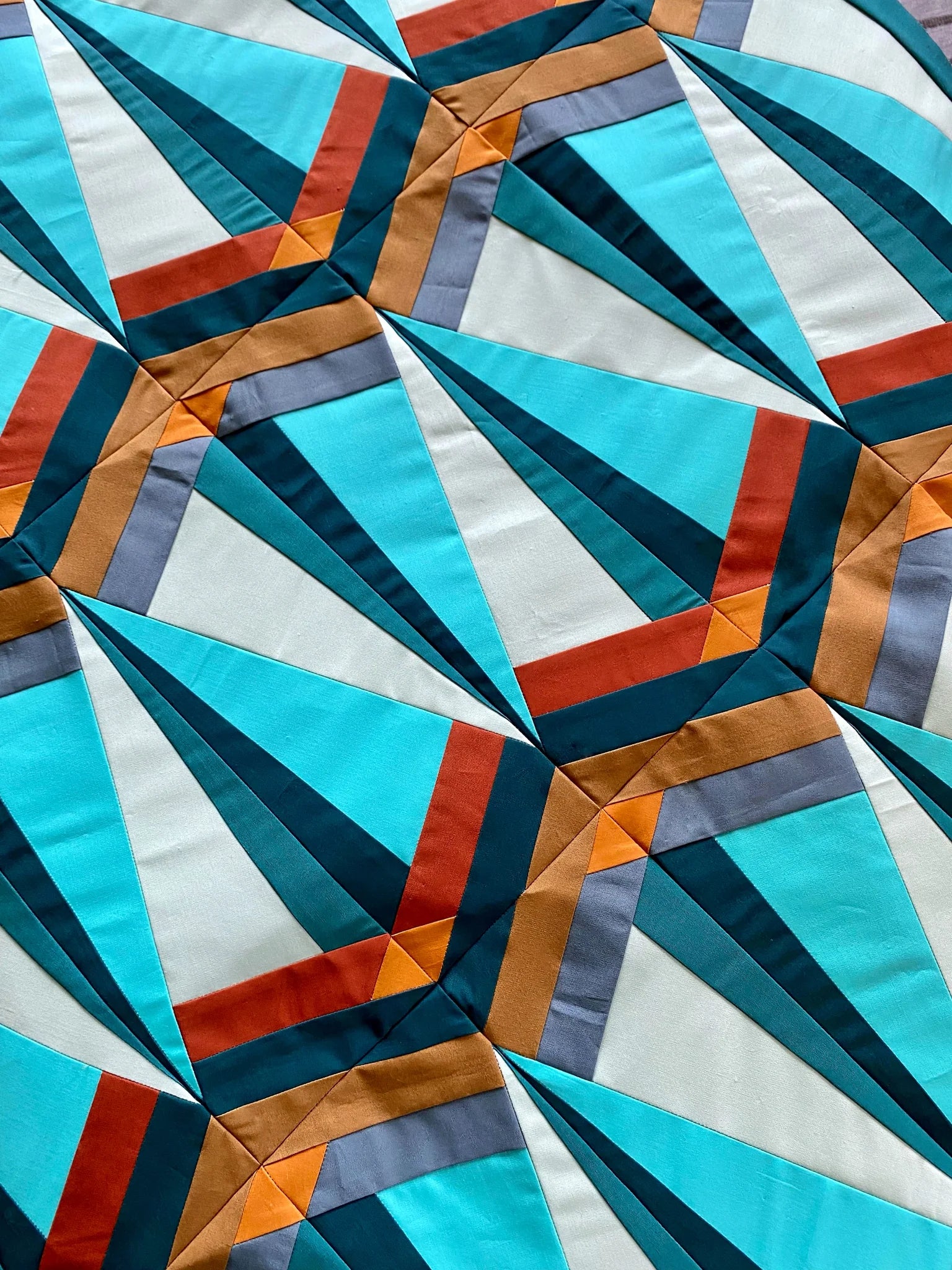 Skye Quilt Pattern - Julia Wachs Designs - A teal and brown Skye quilt.