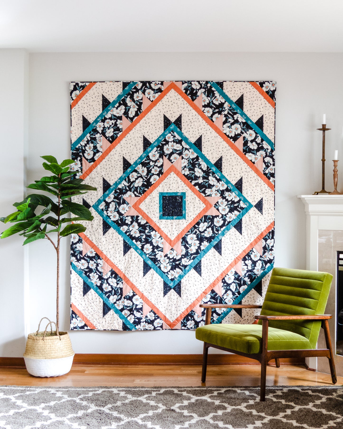 Green Lake Quilt Pattern - Julia Wachs Designs - A Green Lake quilt pattern hangs on a gray wall.